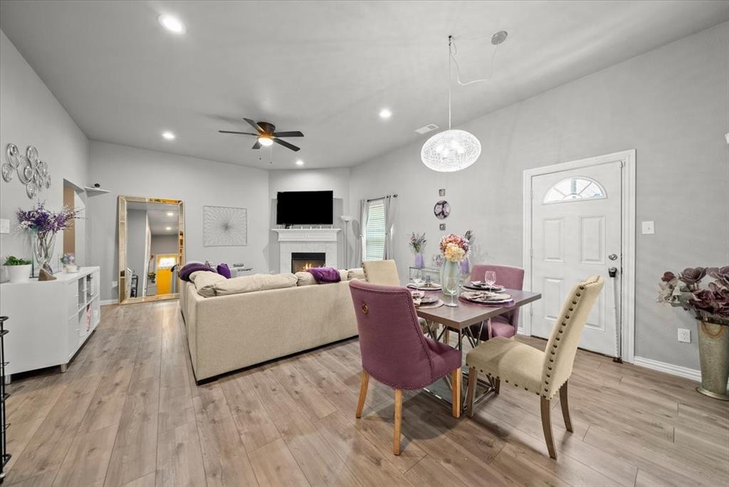 5312 Black Hawk Street Dallas, TX 75212 - Photo 9 of 24 a view of a dining room with furniture and wooden floor