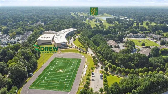 a view of a swimming pool and a yard