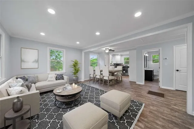 a living room with furniture and wooden floor