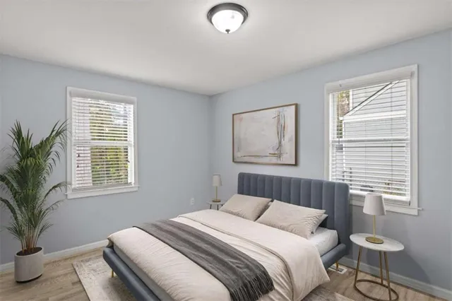 a bedroom with a large bed and a window