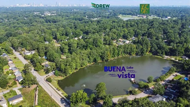 an aerial view of a house with a lake view