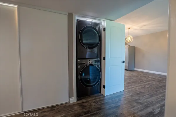 a view of a hallway with washer and dryer