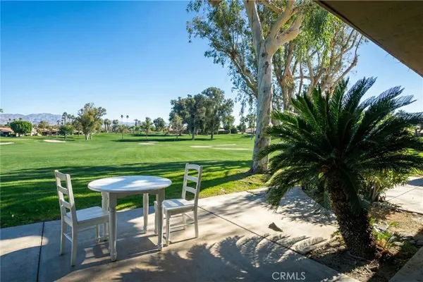 a view of a table and chairs in patio