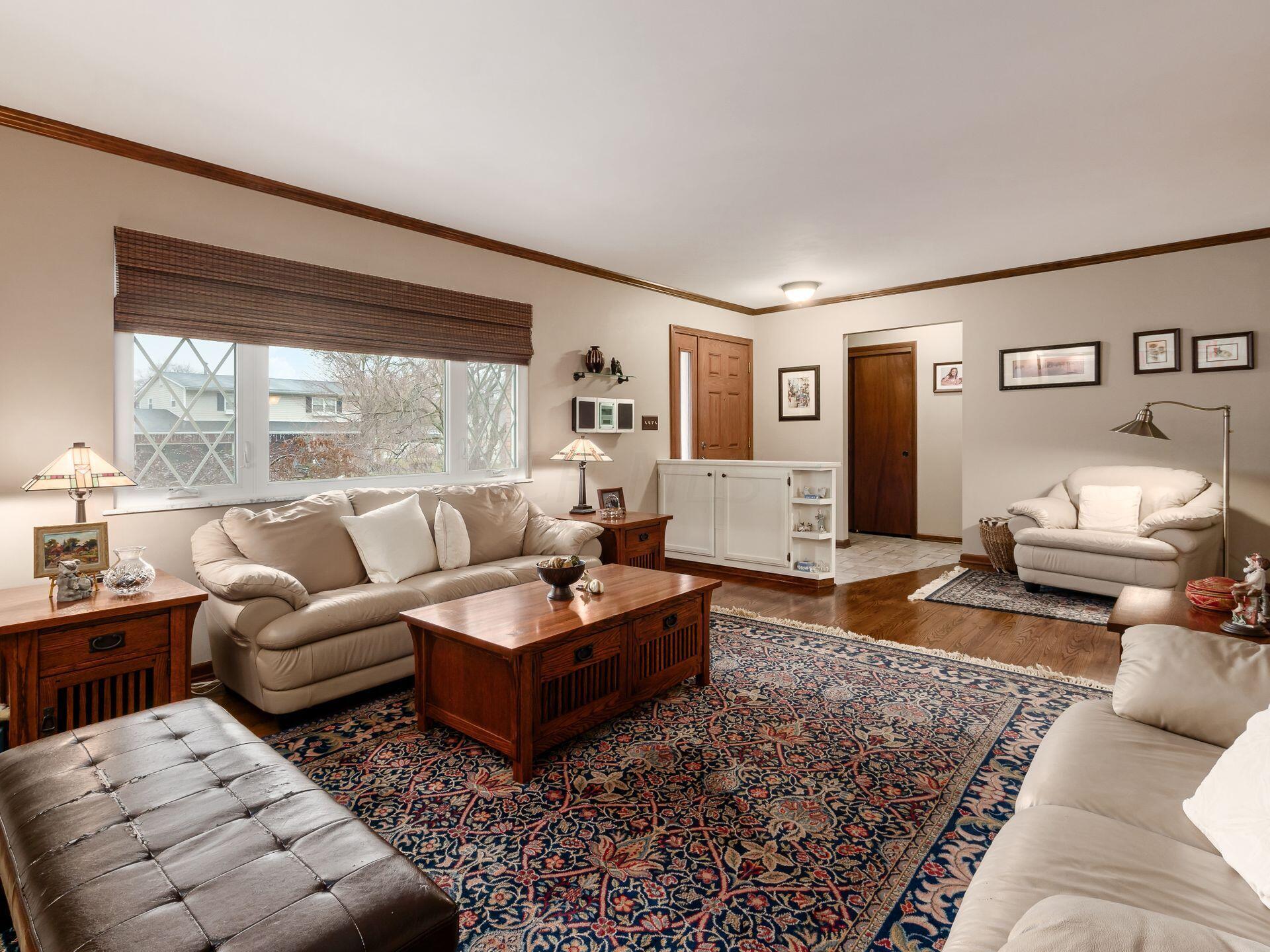 5577 Millington Road Columbus, OH 43235 - Photo 9 of 51 Living Room - Crown Molding, Wood Floors - 18'3" x 13'6"