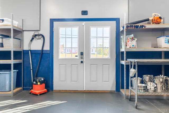 a living room with lots of furniture and kitchen view