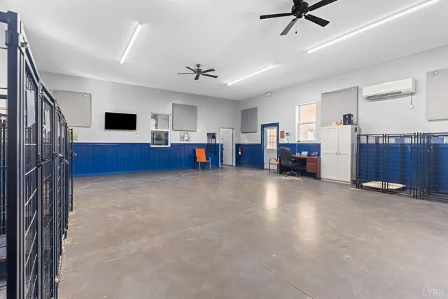 a kitchen with refrigerator and table