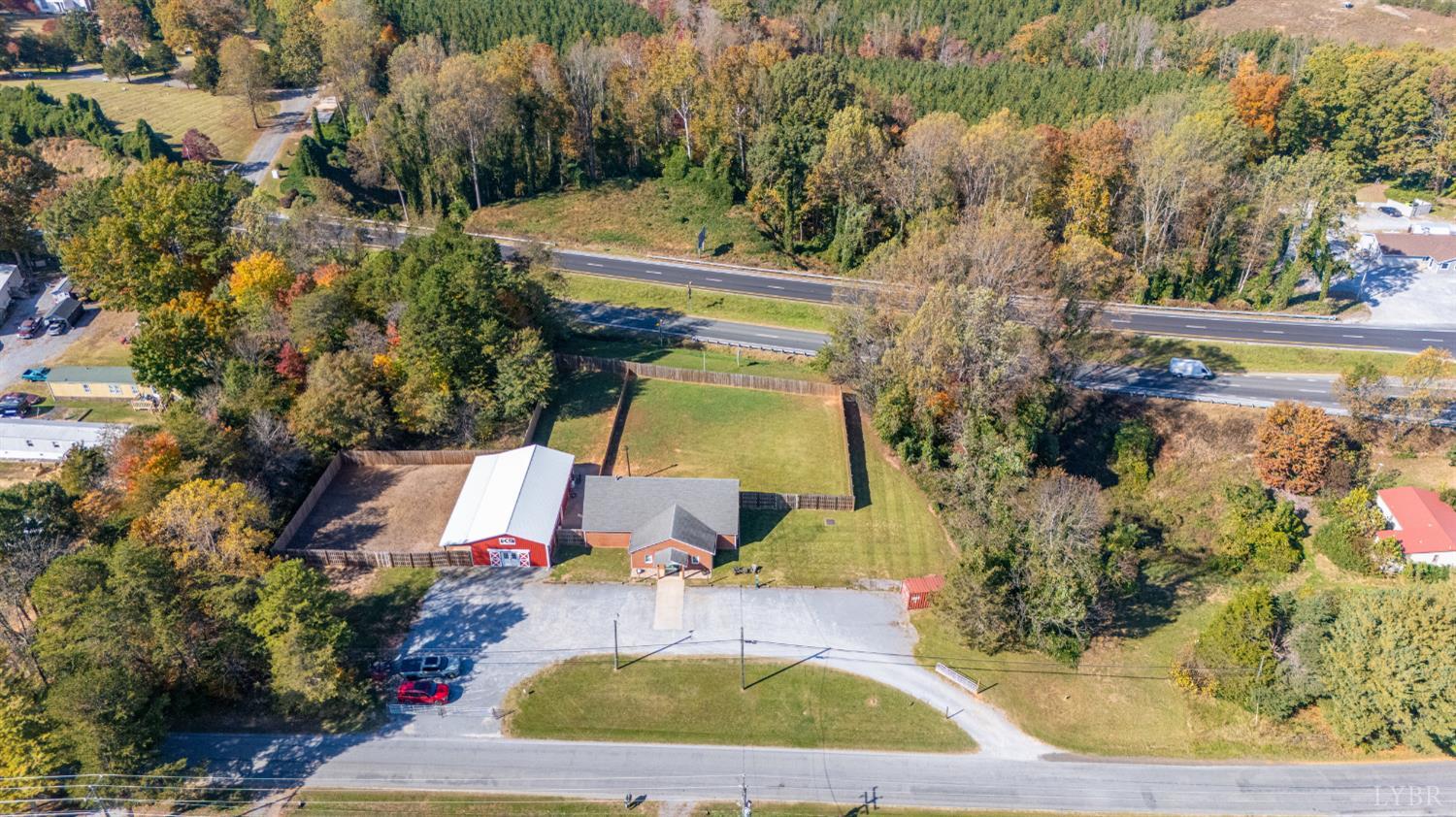 273 Riverbend Road Altavista, VA 24517 - Photo 3 of 57 a view of a yard with plants and large trees