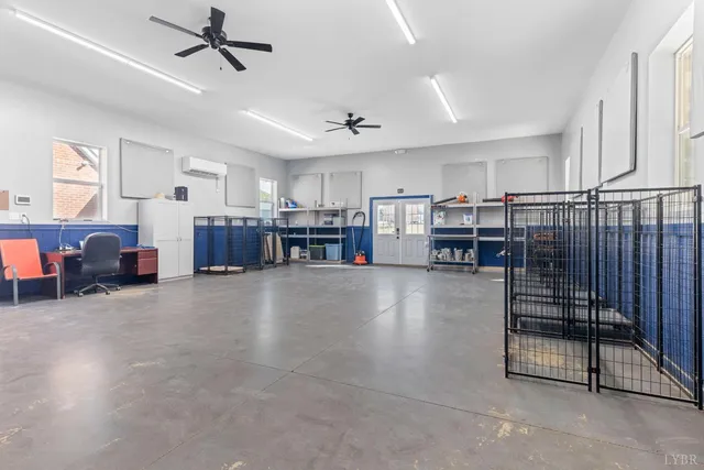 a hallway with wooden floor and staircase