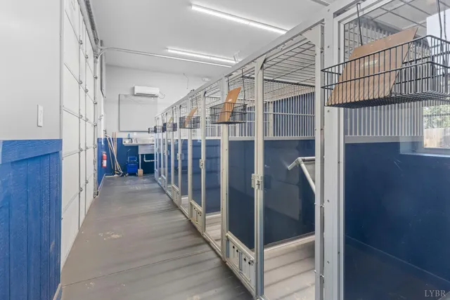 a view of house with yard and garage