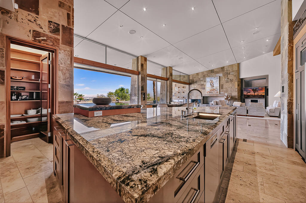 9 Rockcrest Drive Rancho Mirage, CA 92270 - Photo 11 of 64 a kitchen with stainless steel appliances granite countertop a sink stove and refrigerator