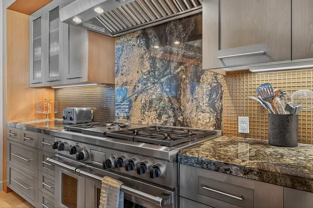 a kitchen with a stove and a sink