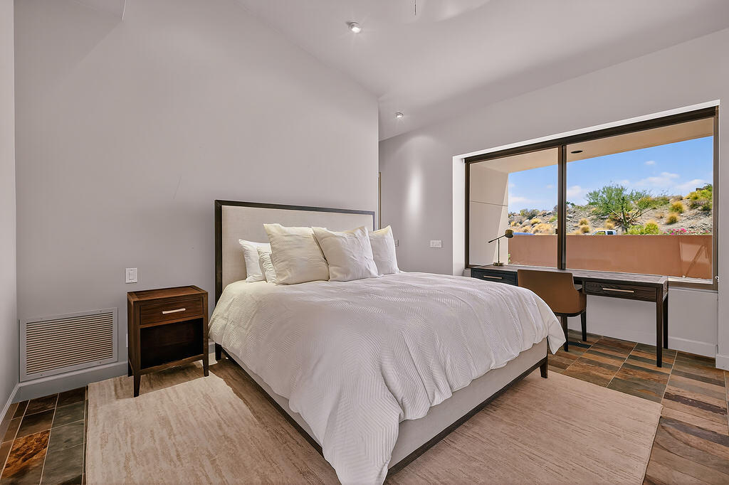 9 Rockcrest Drive Rancho Mirage, CA 92270 - Photo 25 of 64 a bedroom with a bed and a large window
