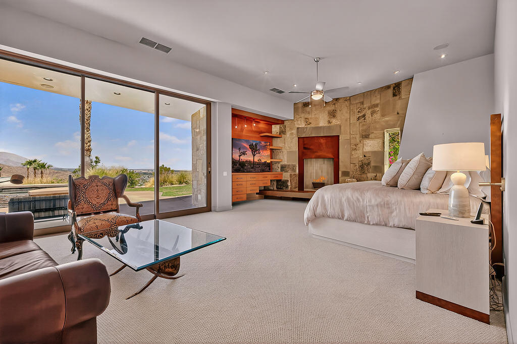 9 Rockcrest Drive Rancho Mirage, CA 92270 - Photo 28 of 64 a living room with furniture and a flat screen tv