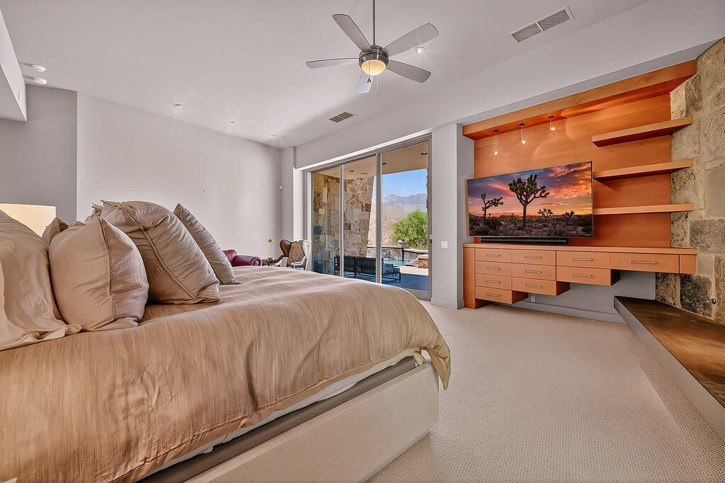 9 Rockcrest Drive Rancho Mirage, CA 92270 - Photo 29 of 64 a bed room with a bed and a large window