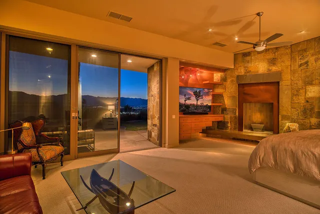 a room with a table and a flat screen tv