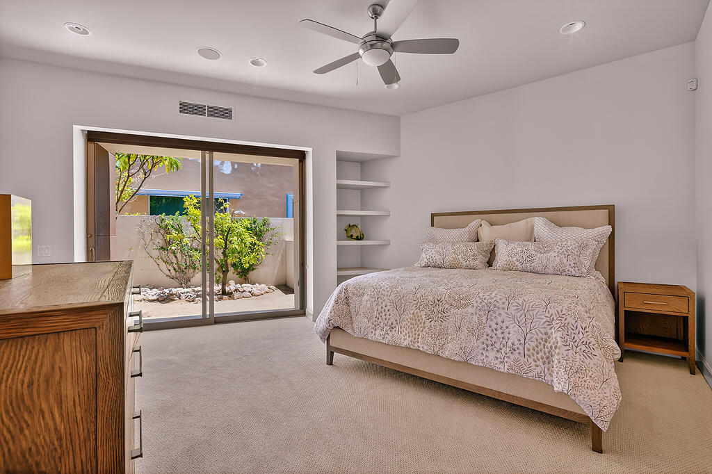 9 Rockcrest Drive Rancho Mirage, CA 92270 - Photo 35 of 64 a spacious bedroom with a bed and a table