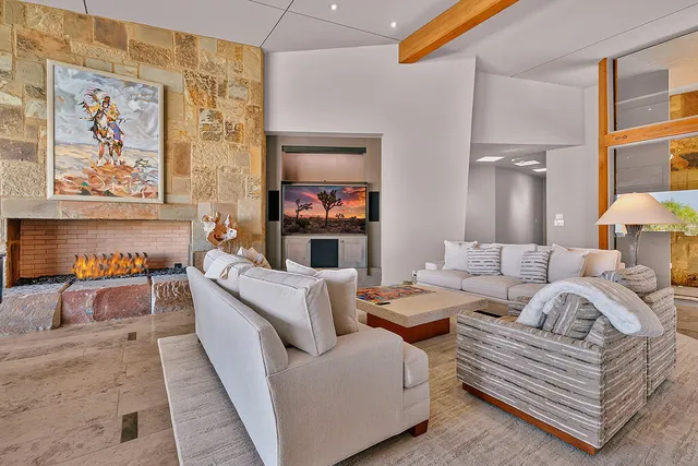 a view of a patio with a table and chairs