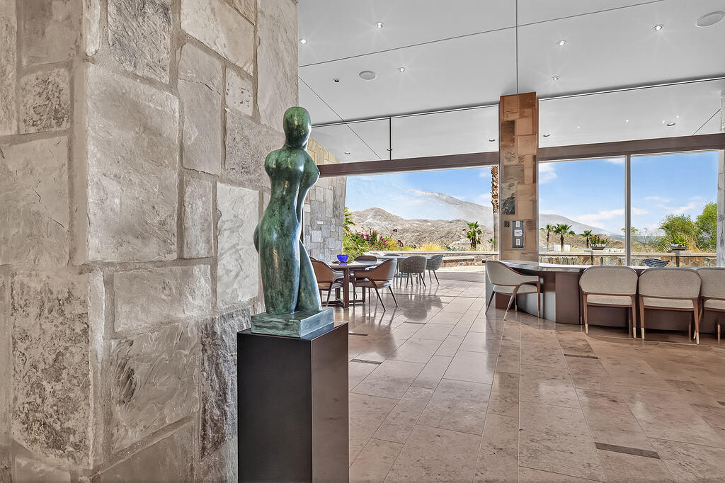 9 Rockcrest Drive Rancho Mirage, CA 92270 - Photo 45 of 64 a lobby with furniture and a floor to ceiling window