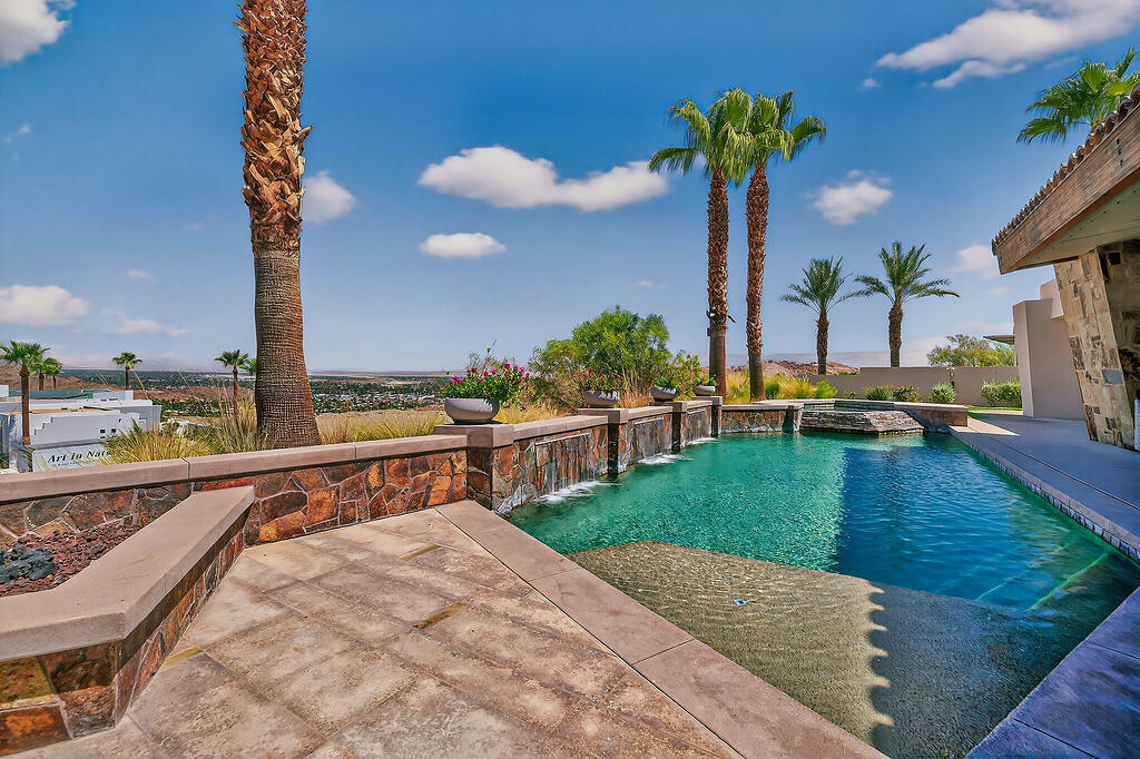 9 Rockcrest Drive Rancho Mirage, CA 92270 - Photo 50 of 64 a view of a swimming pool with a patio and a yard