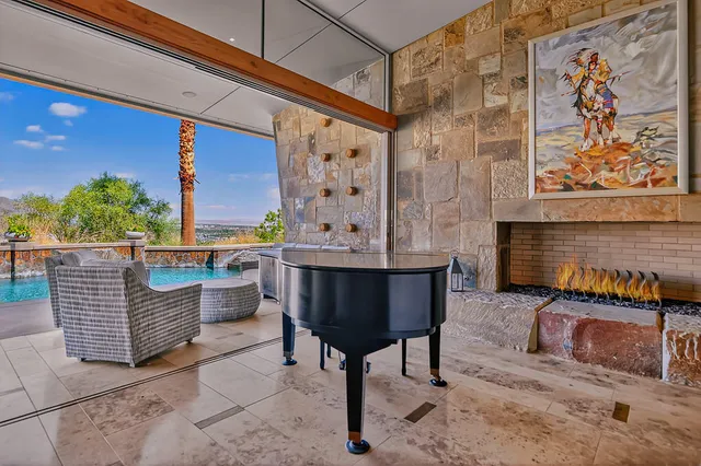 a view of a chairs and table in the patio
