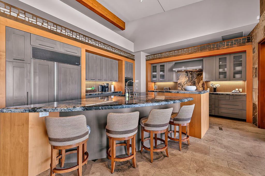 9 Rockcrest Drive Rancho Mirage, CA 92270 - Photo 9 of 64 a kitchen with a table chairs and a dining table