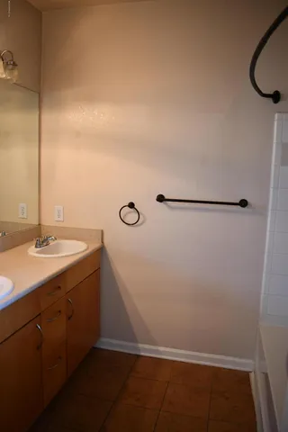 a bathroom with a sink and a mirror