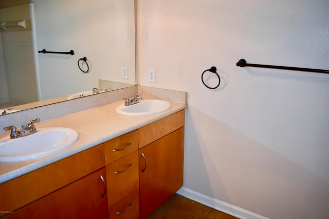 a bathroom with a sink and mirror
