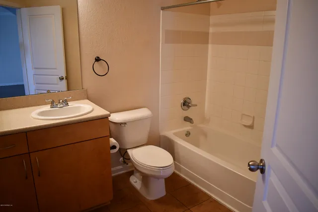 a bathroom with a toilet a sink and a bathtub