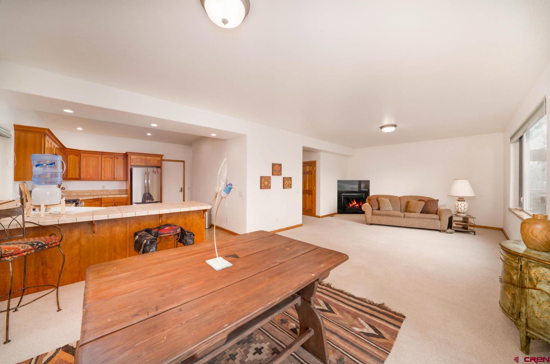 416 Amy Way Ridgway, CO 81432 - Photo 11 of 26 a bedroom with furniture and a large window