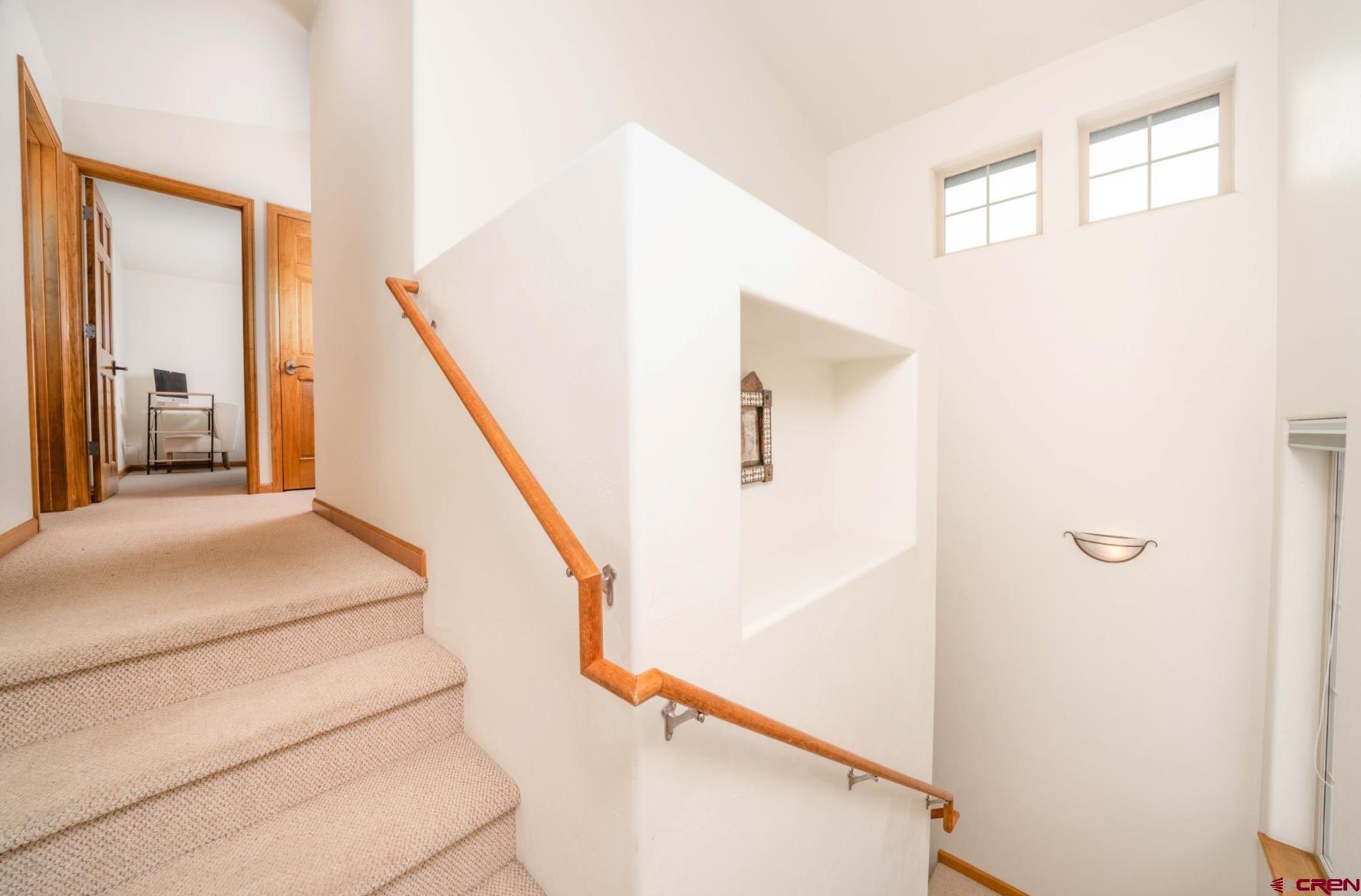 416 Amy Way Ridgway, CO 81432 - Photo 18 of 26 a view of a hallway with staircase