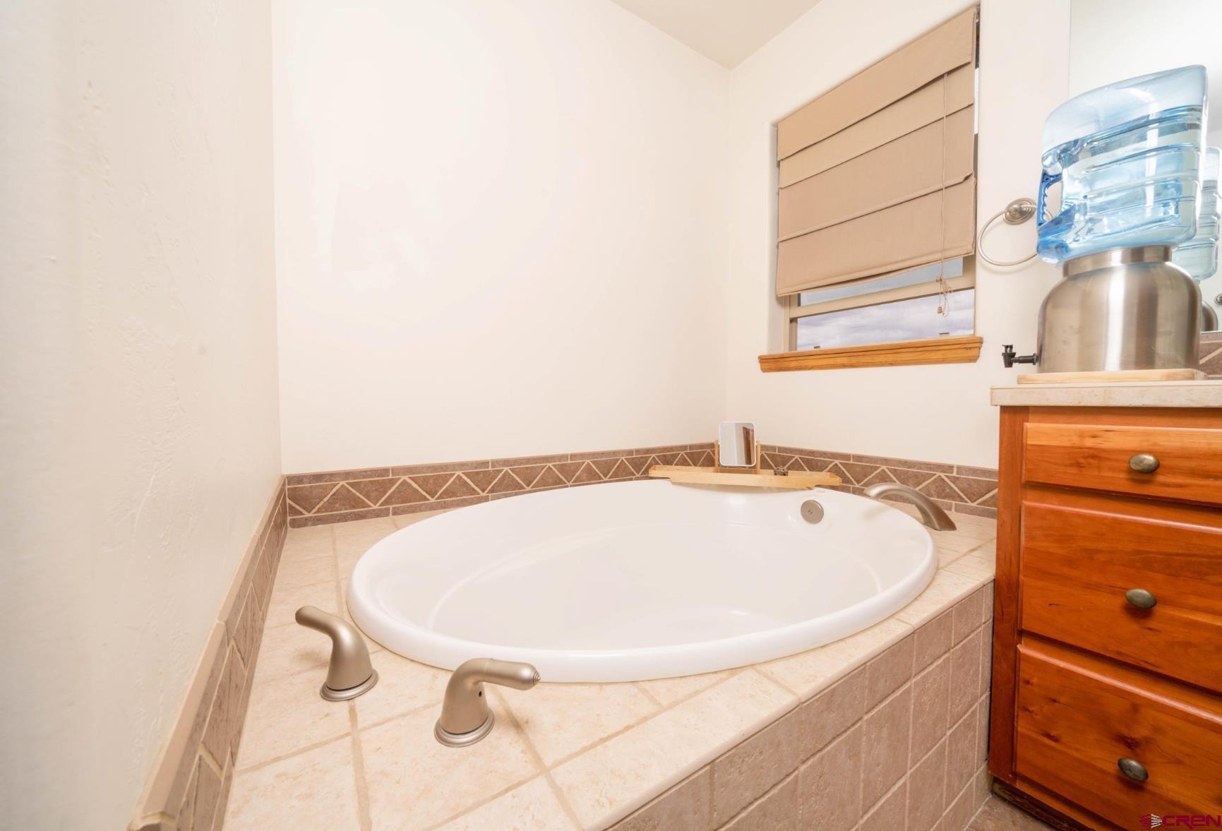 416 Amy Way Ridgway, CO 81432 - Photo 26 of 26 a bathroom with a tub and a sink