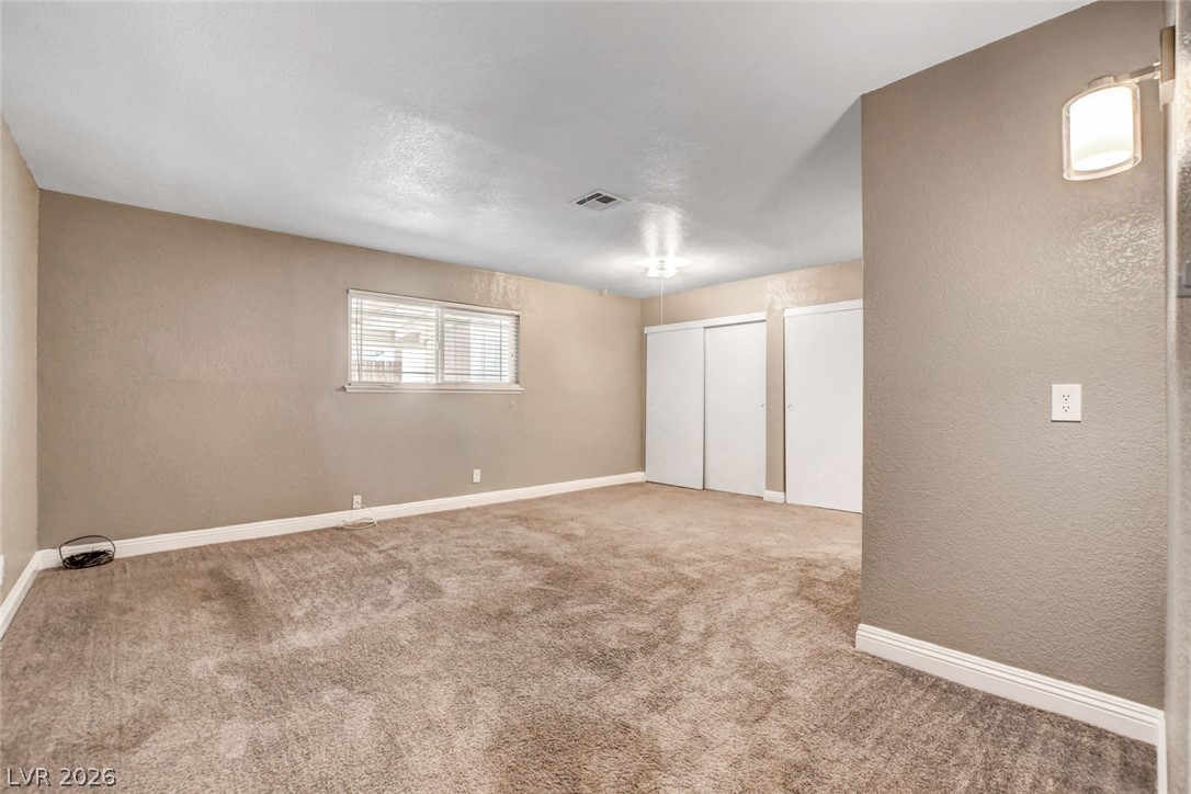 4367 South Mojave Road Las Vegas, NV 89121 - Photo 26 of 53 A generously sized bedroom with plush carpet flooring and ample closet space awaits customization.