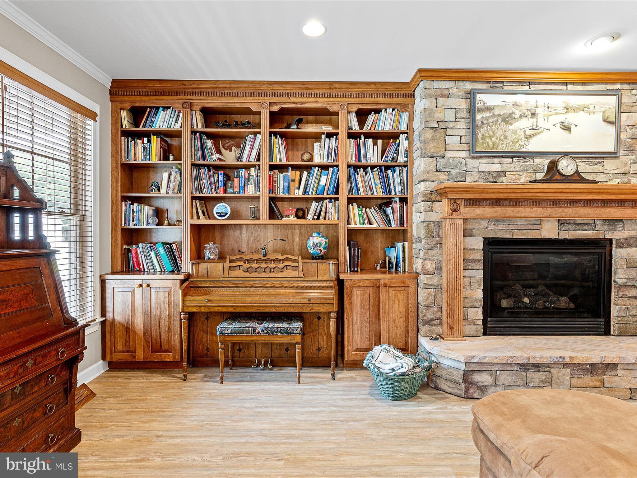 722 Foxtail Drive Bethany Beach, DE 19930 - Photo 7 of 48 Living room with built-in shelving and cabinetry.