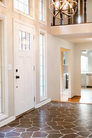 a view of a livingroom with wooden floor and a window