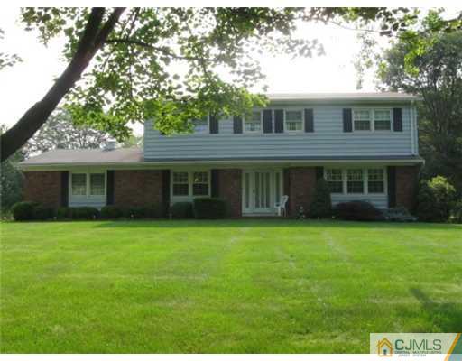 210 Bar Harbor Road Freehold, NJ 07728 - Photo 1 of 9 a front view of a house with a garden