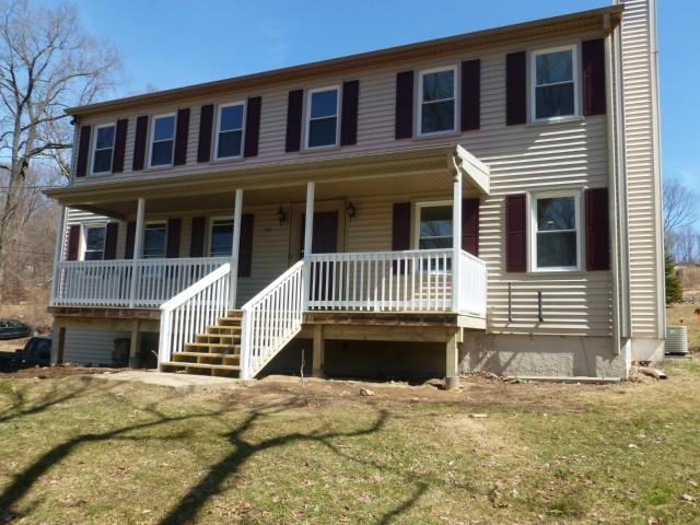 166 Old Zoar Road Monroe, CT 06468 - Photo 1 of 1 a front view of a house with a yard