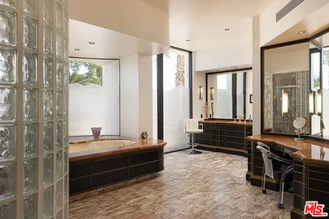 a room with a bed and a view of bathroom