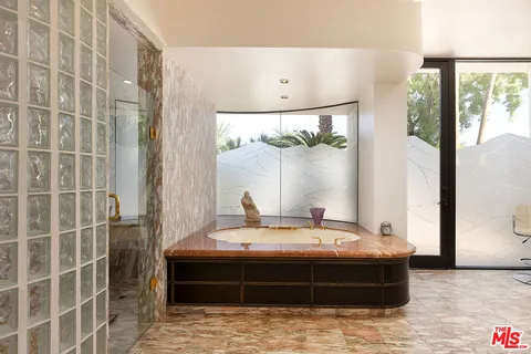 a bathroom with a bathtub and a sink