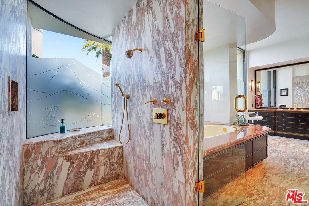 70418 Placerville Road Rancho Mirage, CA 92270 - Photo 23 of 42 a en suite bathroom with a tub shower and mirror