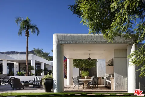 a front view of a building with garden