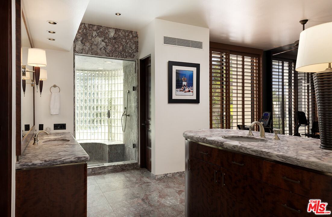 70418 Placerville Road Rancho Mirage, CA 92270 - Photo 25 of 42 a bathroom with a granite countertop sink and a mirror