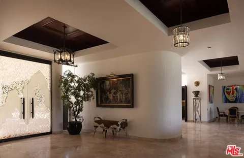 a view of a livingroom with furniture and a ceiling fan