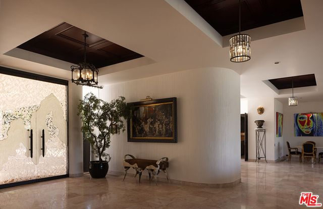 a view of a livingroom with furniture and a ceiling fan
