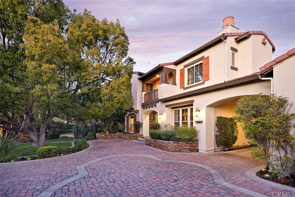 10464 Caribou Way Tustin, CA 92782 - Photo 1 of 34 a front view of a house with garden
