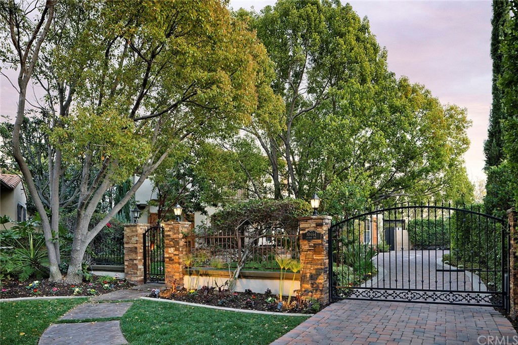 10464 Caribou Way Tustin, CA 92782 - Photo 2 of 34 a view of a yard with large trees and plants