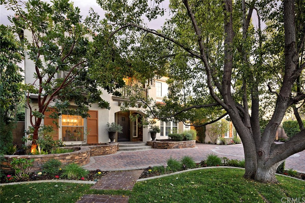 10464 Caribou Way Tustin, CA 92782 - Photo 23 of 34 front view of a house with a tree and plants