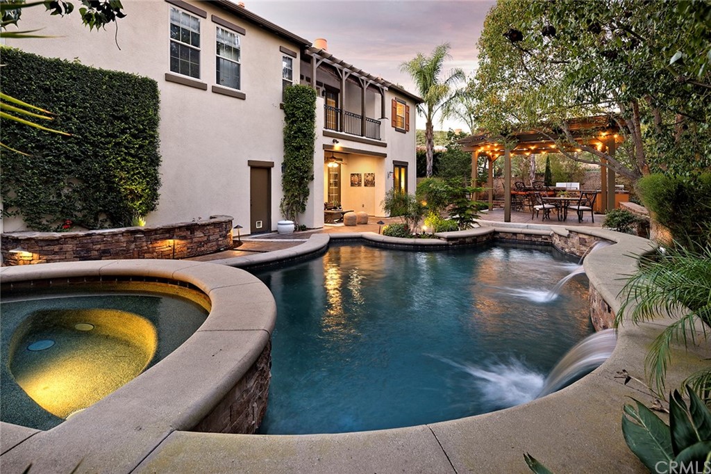10464 Caribou Way Tustin, CA 92782 - Photo 25 of 34 a view of swimming pool with chairs and fire pit