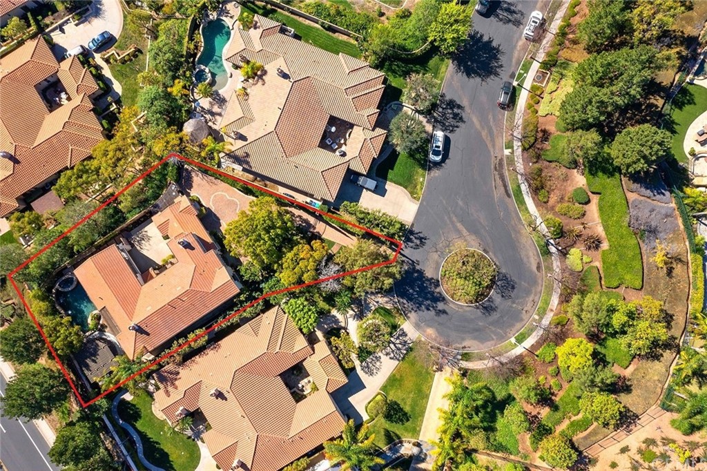 10464 Caribou Way Tustin, CA 92782 - Photo 27 of 34 an aerial view of a house with a yard and garden