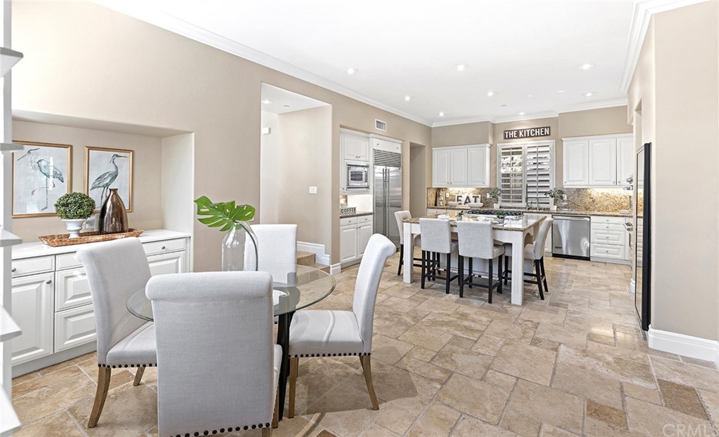 10464 Caribou Way Tustin, CA 92782 - Photo 7 of 34 a view of a dining room with furniture