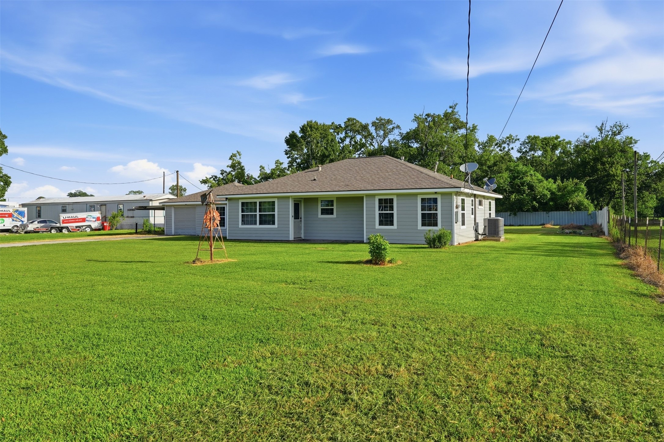 212 Jones Road Highlands, TX 77562 - Photo 3 of 24 a front view of a house with a garden